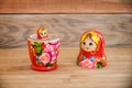 Matryoshkas, russian nesting dolls on wood background, mother, daughter and family concept Royalty Free Stock Photo