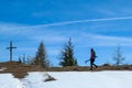 Matschacher Gupf - A woman in hiking outfit reaching the cross on top of Matschacher Gupf, Alpine peak in Austria Royalty Free Stock Photo