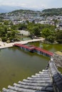 Matsumoto - Japan, June 6, 2017: Red bridge over the moat seen f Royalty Free Stock Photo