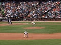 Matt Cain throws pitch as 2nd base Freddy Sanchez Royalty Free Stock Photo