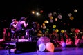 Matt and Kim, energetic indie pop couple surrounded by colorful balloons launched by the audience