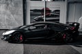 Matte black Lamborghini Aventador SVJ with red accents