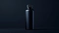 Matte Black Metal Bottle on Dark Background in Studio Lighting Minimalist Royalty Free Stock Photo
