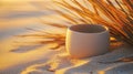matte ceramic container on warm sand under palm leaf shadows
