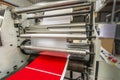 Matte or gloss plastic machine in a printing press for a perfect finish of printed documents. Royalty Free Stock Photo