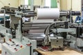 Matte or gloss plastic machine in a printing press for a perfect finish of printed documents. Royalty Free Stock Photo