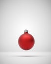 Matte red Christmas bubble on grey light background Royalty Free Stock Photo