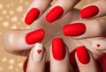 Matte red nails with small red heart on beige colour nail on the red fabric background. Saint Valentine\'s nail design
