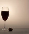 Matte wineglass half red wine cork on table Royalty Free Stock Photo