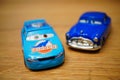 Mattel Weathers and Hudson toy model car from the Disney Pixar Cars series on a wooden surface
