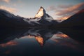Matterhorn mountain reflected in the lake at sunset, Switzerland.