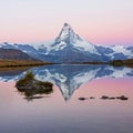 Matterhorn mountain before sunrise with reflection in the Riffelsee lake - Zermatt in Switzerland Royalty Free Stock Photo