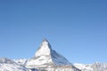 Matterhorn peak in Zermatt in winter with snow and blue sky on a sunny day in the Alps, Switzerland Royalty Free Stock Photo