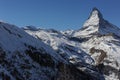 Matterhorn peak in Zermatt in winter with snow and blue sky on a sunny day in the Alps, Switzerland Royalty Free Stock Photo