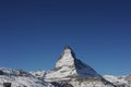 Matterhorn peak in Zermatt in winter with snow and blue sky on a sunny day in the Alps, Switzerland Royalty Free Stock Photo