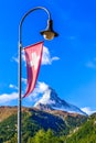 Matterhorn, Swiss flag and street light Royalty Free Stock Photo