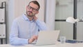 Middle Aged Man having Neck Pain while Working on Laptop Royalty Free Stock Photo