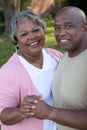 Mature African American couple laughing and hugging. Royalty Free Stock Photo