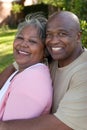 Mature African American couple laughing and hugging. Royalty Free Stock Photo