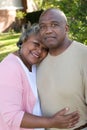 Mature African American couple laughing and hugging. Royalty Free Stock Photo