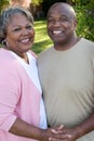 Mature African American couple laughing and hugging. Royalty Free Stock Photo