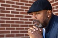 Mature African American man praying. Royalty Free Stock Photo