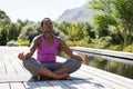 Mature black woman in lotus position