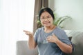 Mature Asian deaf disabled woman using Sign Language to communicate with other people Royalty Free Stock Photo