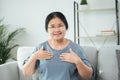 Mature Asian deaf disabled woman using Sign Language to communicate with other people Royalty Free Stock Photo