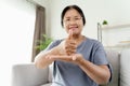 Mature Asian deaf disabled woman using Sign Language to communicate with other people Royalty Free Stock Photo