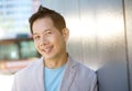 Mature asian man smiling outdoors Royalty Free Stock Photo