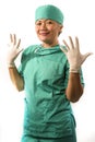 Mature attractive and happy medicine doctor woman or hospital nurse in medical scrubs latex gloves and mask smiling confident Royalty Free Stock Photo