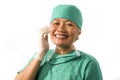 Mature attractive and happy medicine doctor woman or hospital nurse in medical scrubs latex gloves and mask smiling confident Royalty Free Stock Photo