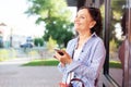Mature attractive stylish woman retired using mobile phone app