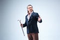 The mature barded man in a suit holding cane. Royalty Free Stock Photo