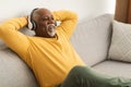 Mature Black Man Listening To Music Wearing Headphones At Home Royalty Free Stock Photo