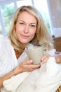 Mature blond woman with cup of tea Royalty Free Stock Photo