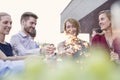 Mature business colleagues talking during success party on rooftop Royalty Free Stock Photo