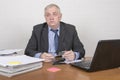 Mature business man in an office setting looking tired Royalty Free Stock Photo