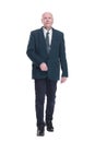 Mature business man striding forward. isolated on a white background. Royalty Free Stock Photo