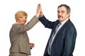 Mature business people give high five Royalty Free Stock Photo