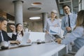 Mature business woman explaining project details on a meeting in office Royalty Free Stock Photo