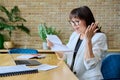 Mature business woman reading an important letter, rejoicing at good news Royalty Free Stock Photo