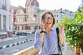 Mature business woman talking on cell phone walking down city street Royalty Free Stock Photo