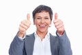 Mature business woman with thumbs up. Closeup of smiling mature business woman gesturing thumbs up sign over white Royalty Free Stock Photo