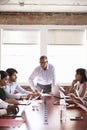 Mature Businessman Addressing Boardroom Meeting