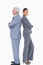 Mature businessman back to back with colleague Royalty Free Stock Photo