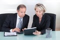 Mature businessman and businesswoman planning