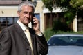 Mature businessman on cell phone