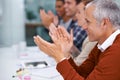 Mature businessman, happy and applause in presentation in seminar and celebration by coworkers in conference room Royalty Free Stock Photo